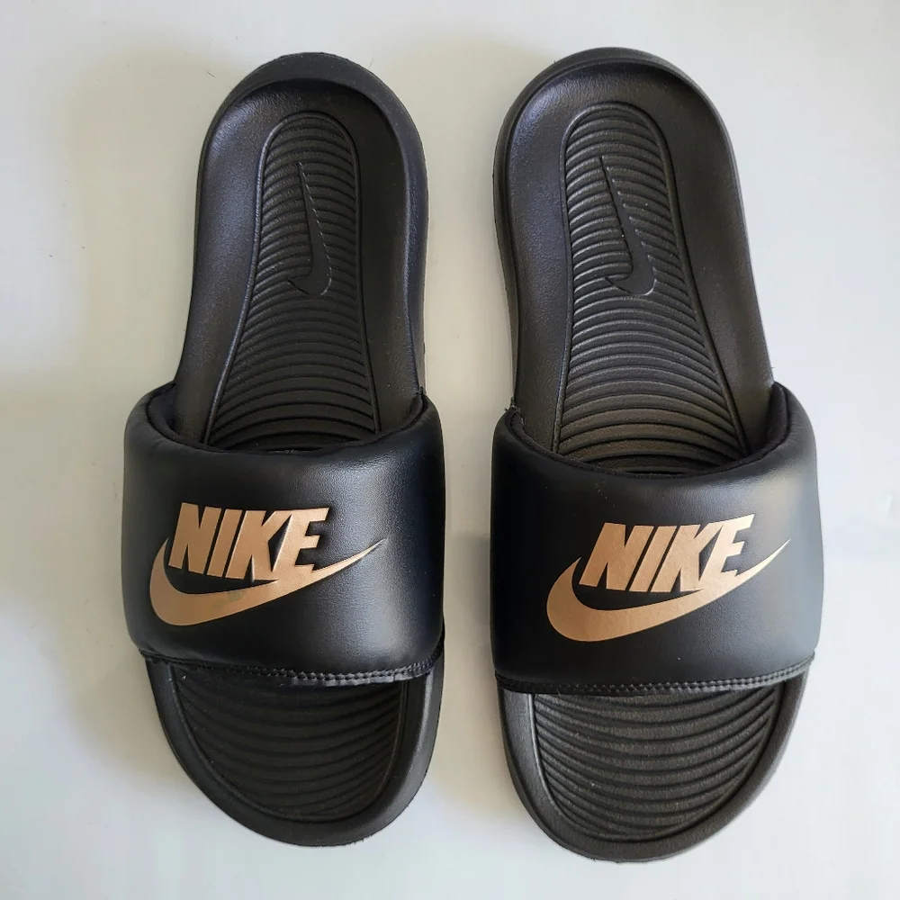 Nike Black Slides with Gold Logo